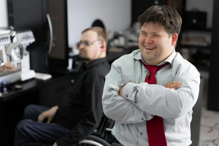 Smiling employee in office setting promoting inclusivity and diversity.